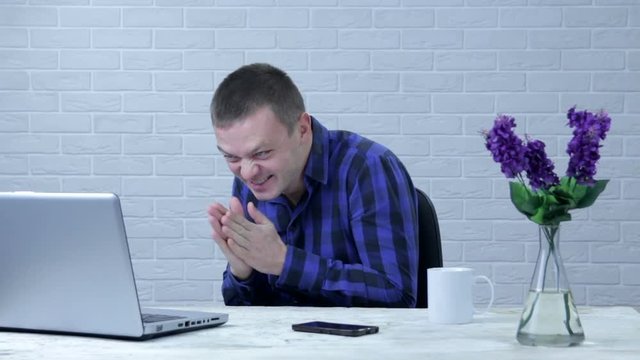 A businessman rubbing his hands, a cunning handsome plans his cunning