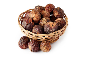 Soap nuts (soapberries) isolated on white background. Chemical and toxin free laundry, organic detergent