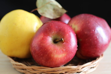 Yellow quince and red apples