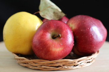 Yellow quince and red apples