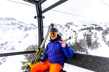 Skier traveling on the cable car