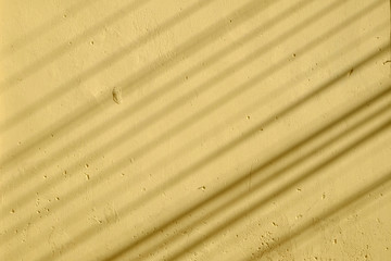shadow on yellow wall