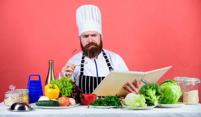 Try something new. Cookery on my mind. Cooking skill. Book recipes. According to recipe. Man bearded chef cooking food. Check if you have all ingredients. Cook read book recipes. Man learn recipe