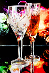 Two beautiful wine glasses on a beautiful background.