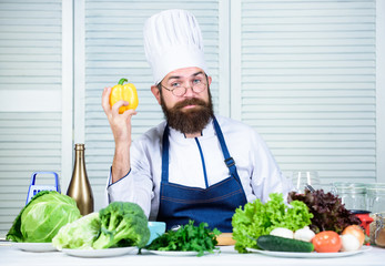 Cooking process. Vegetarian. Mature chef with beard. Healthy food cooking. Dieting and organic food, vitamin. Bearded man cook in kitchen, culinary. Chef man in hat. Secret taste recipe