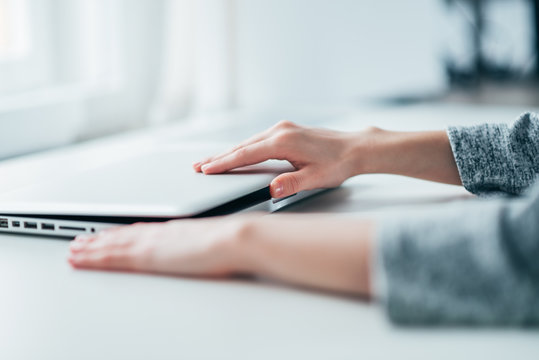 Woman Closing/opening Laptop In The Office.