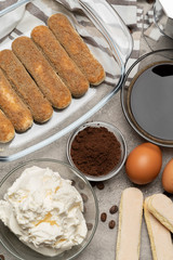 Ingredients for making traditional italian cake tiramisu on concrete table