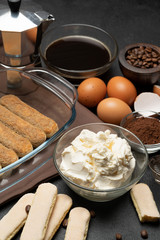 Ingredients for making traditional italian cake tiramisu on concrete table