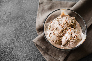 A plate of homemade chocolate ice cream with chocolate chips.