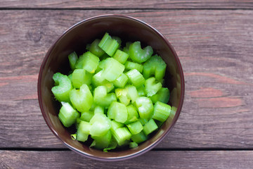 fresh celery sliced for salad, on wooden background
