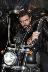 Fashion portrait of young handsome and sexy biker man.