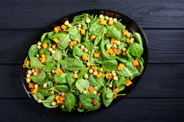 autumn salad with pumpkin , spinach , chickpea and sesame