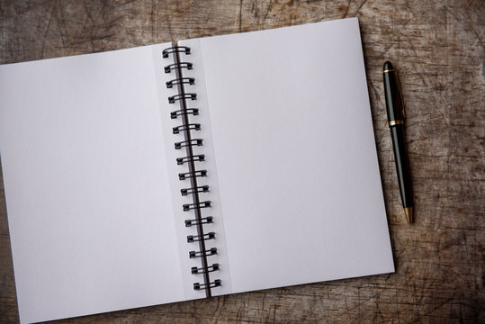 Two Blank Pages With A Pen, Taken On A Metal Background With Copy Space