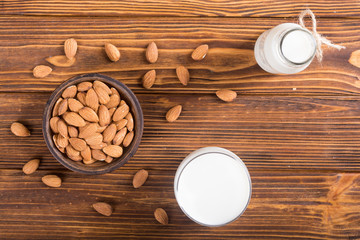 Almond milk on wooden table
