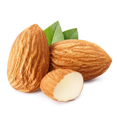 Close-up of almonds with leaves, isolated on white background