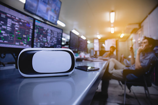 VR Box / Virtual Reality glasses  in the production control room.Control room of a steam Turbine,Generators of the coal-fired power plant for monitor process, business and industry concept