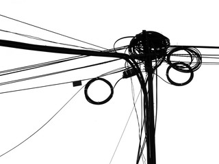 chaotic wire on pole with sky background in black and white