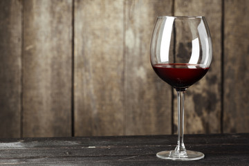 Glass of Wine on The Wooden Table