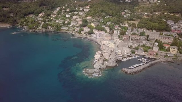 Aerial footage of the ancient Tower and Harbor of Corsican city Erbalunga, France