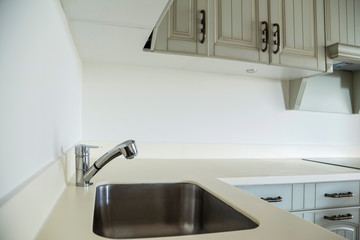 tap and sink of a new kitchen