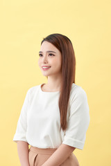 Obraz premium Asian woman smiling with dimple long hair black eyes on yellow background