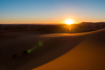 Fototapeta na wymiar Merzouga / Morocco - March 26, 2019: Sunrise at Erg Chebbi, the Sahara