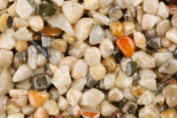 Extreme close up of colorful natural stone carpet. Decorative stone coating. Slip resistant floor...