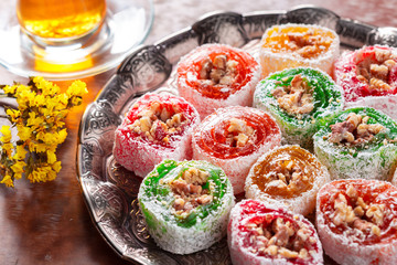 various pieces of turkish delight lokum and black tea