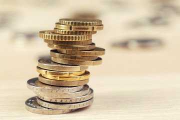 piles of coins on working table
