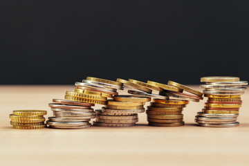 piles of coins on working table