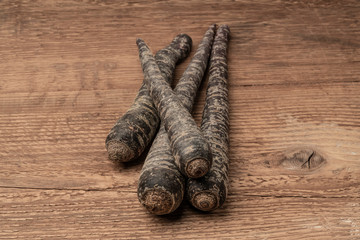 some red carrots on a wooden table