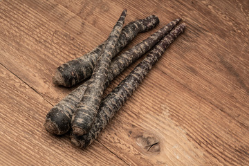 some red carrots on a wooden table