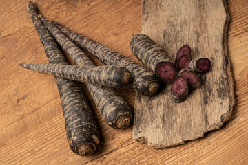 chopped red carrot on a wooden table