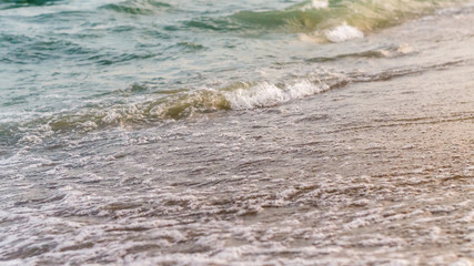 Seaside beach and soft blue sea wave.