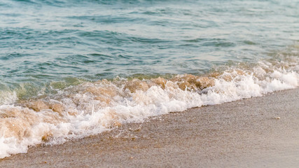 Seaside beach and soft blue sea wave.