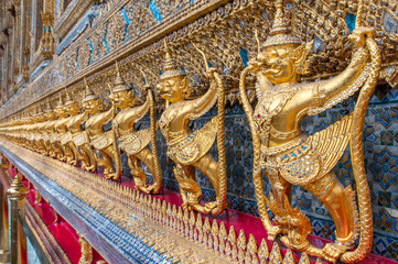 Fototapeta premium Garudas and nagas on external decorations of the Ubosoth, Wat Phra Kaew temple, Grand Palace, Bangkok, Thailand.