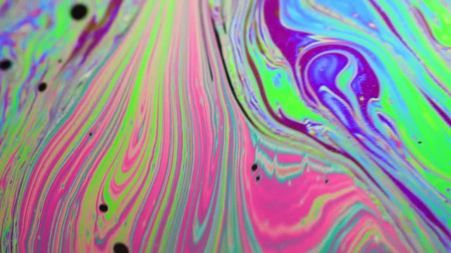 Macro shot of moving abstract surface of colorful bubble.