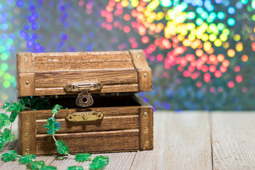 Happy St. Patrick's Day fun rainbow background with lucky treasure chest 