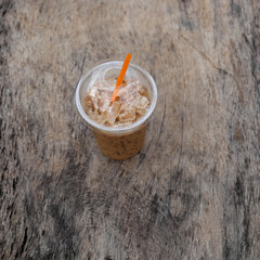 Ice coffee on wooden table