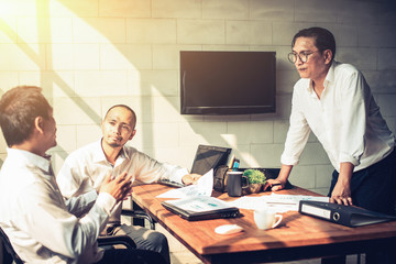 Businessmen are meeting in the office.