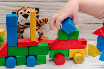 Fototapeta premium Children's wooden designer from blocks of a different form