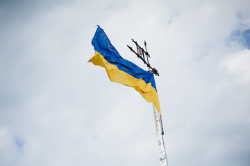 Flag of Ukraine in flying on the wind in the sky