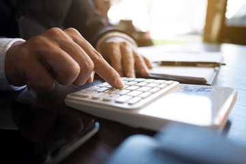 Businessmen calculate investment expansion business, saving money .finance concept .