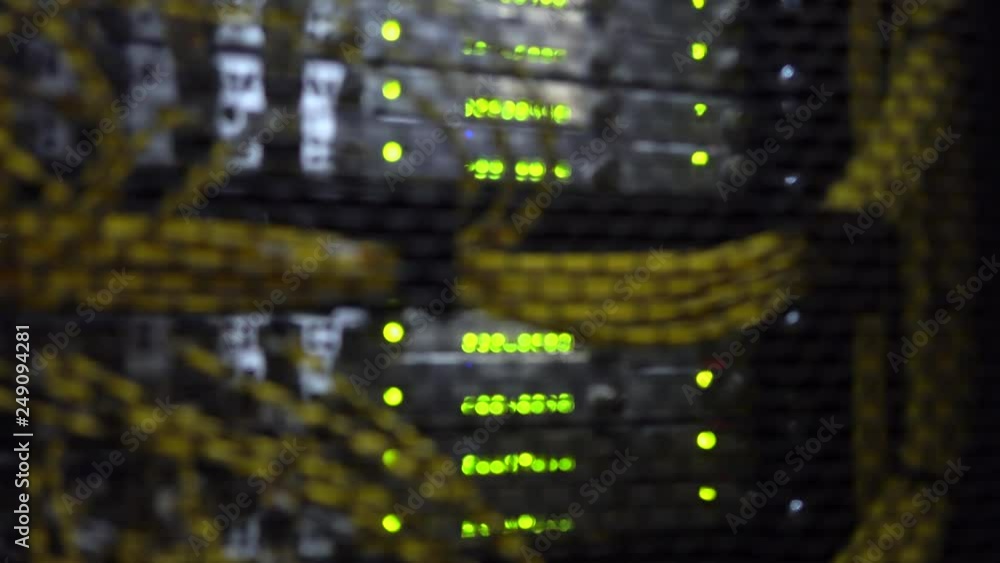 Aufkleber working data servers with flashing led lights. blurred background. yellow cable. datacenter in blue 
