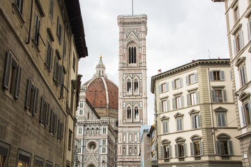 Fototapeta na wymiar Basilica di Santa Maria del Fiore with Giotto campanile tower bell and Baptistery of San Giovanni. View from street of Florence, Italy.