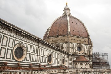 Fototapeta premium Florence Duomo. Basilica di Santa Maria del Fiore (Basilica of Saint Mary of the Flower). Florence Cathedral from Giotto's bell tower. Cloudy, dramatic and rainy sky. Florence, Italy.