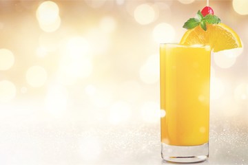 Orange juice and slices of orange on background