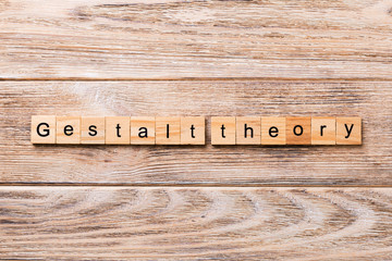 gestalt theory word written on wood block. gestalt theory text on wooden table for your desing,...