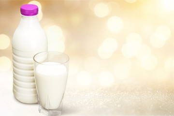 Milk carton package and glass on  background