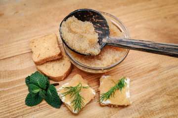 Granular pike caviar on slices of bread